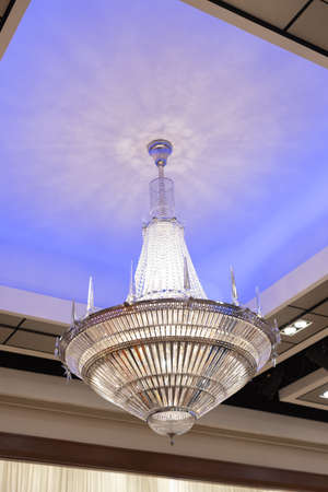 A interior luxury crystal chandler light hanging on ceiling.の写真素材