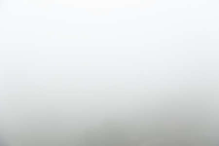 abstract background of empty defocus blurred morning mist or fogの写真素材