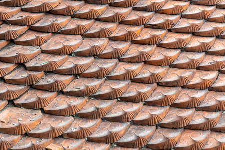 surface of traditional clay roof tiles of chinese asian temple background textureの写真素材