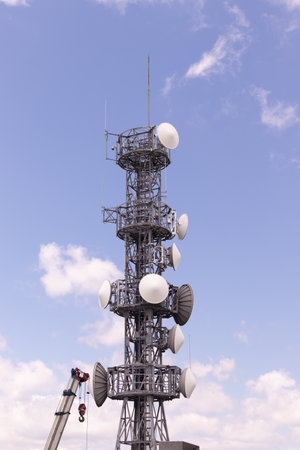 Communication transmitter tower with beautiful sky and cloud.