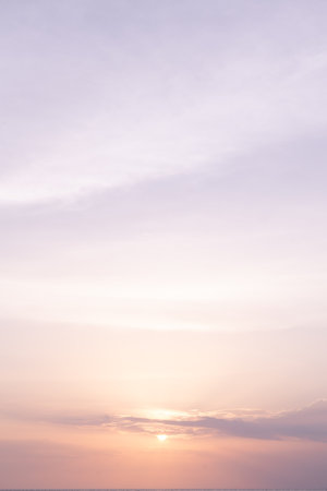 Clear blue sky sunset with glowing pink and purple horizon background