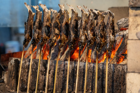 selective focus of Grilled fish on skewers. A traditional Street food in Japan.