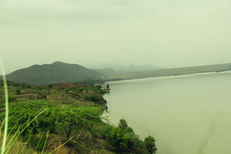 Beautiful view of the lake and mountain in the rainy season.の写真素材