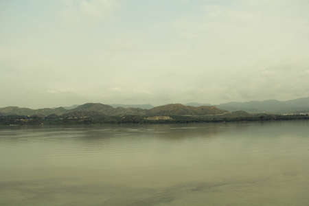 Beautiful view of the river with mountains in the background.の写真素材