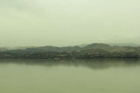 View of the mountains and the lake in the early morning, Sri Lankaの写真素材