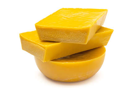 Large pieces of natural, pure organic yellow beeswax isolated on white background.の写真素材