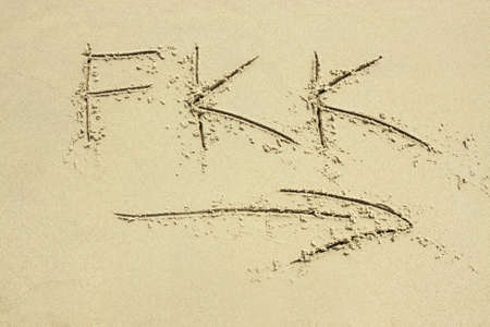 FKK - handwritten in sand beach. Naturist beach