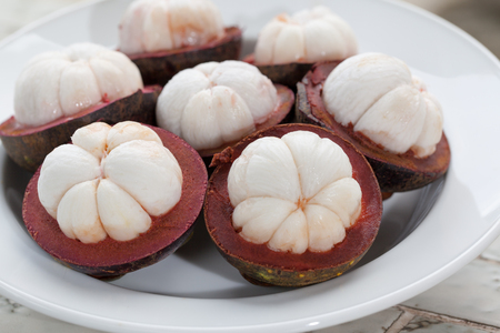 tropical mangosteen fruit on wood tableの写真素材