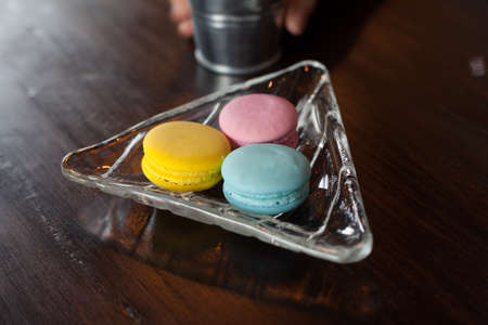 Three Color Macaron on Wood tableの写真素材