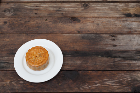 Moon Cake close up on old wood table , Chinese Cultureの写真素材