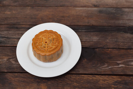 Moon Cake close up on old wood table , Chinese Cultureの写真素材