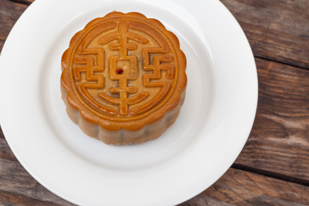 Moon Cake close up on old wood table , Chinese Cultureの写真素材