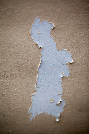 Background texture of the old cracked wall with peeling paint and plasterの写真素材