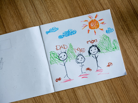 Family drawing on wood floorの写真素材