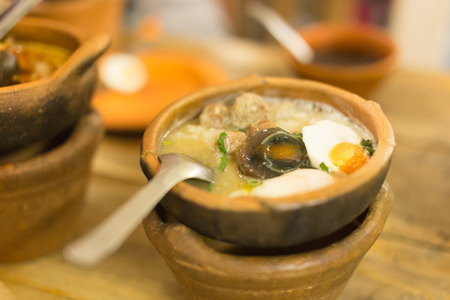 mush pork and Eggs rice soup in Clay pot thai styleの写真素材