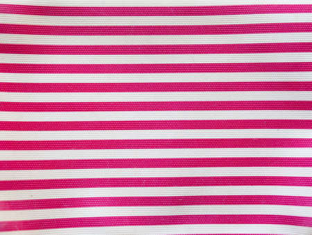 Horizontal striped pattern with red pink and white stripes.の写真素材