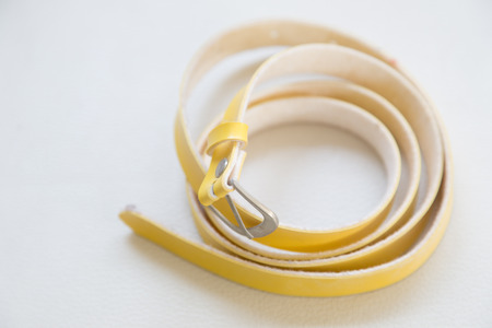 yellow fashion belt on white background.