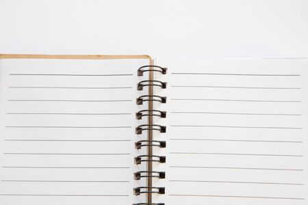 Open notebook with white page backgroundの写真素材