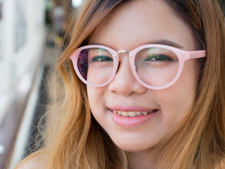 Young asian woman smile on bokeh background, right side compostの写真素材