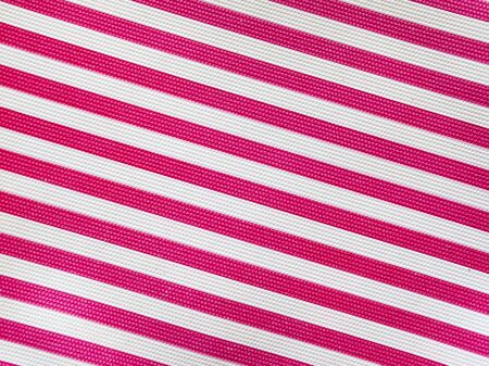 diagonal striped pattern with red and white stripes.の写真素材