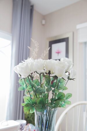 White roses in a glass vaseの写真素材