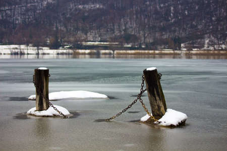 Iced pier on the lakeの写真素材