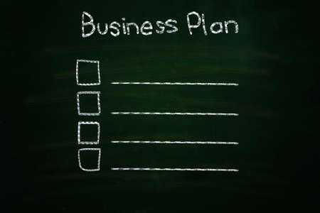 business plan illustration sketched with chalk on blackboardの写真素材