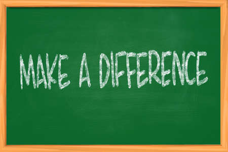 The words Make a Difference written with chalk on blackboardの写真素材