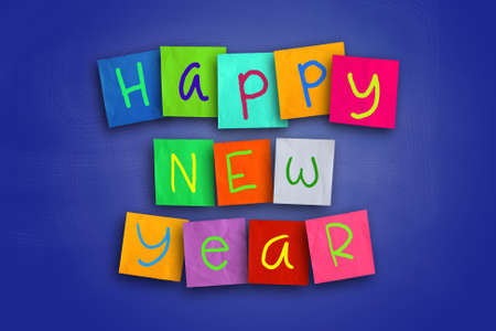 The words Happy New Year written on sticky colored paperの写真素材