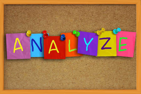 Image of the word Analyze written on sticky colored paper over cork boardの写真素材