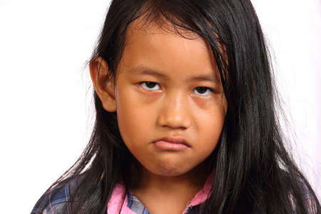 Little girl looked angry isolated on whiteの写真素材