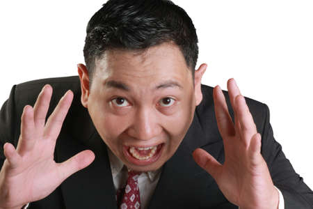 Business concept image of a stressed Asian businessman screaming isolated on white