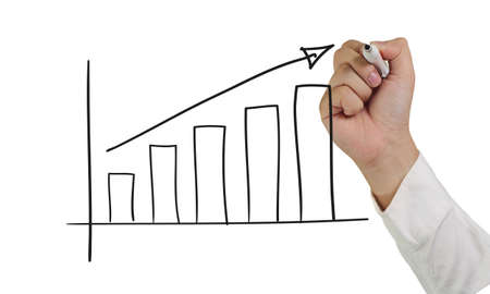 Motivational concept image of a hand holding marker and draw up graphic isolated on whiteの写真素材