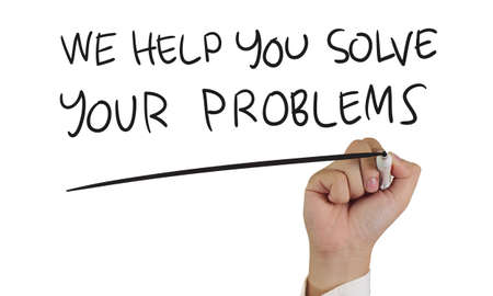 Motivational concept image of a hand holding marker and write We Help You Solve Your Problems isolated on whiteの写真素材