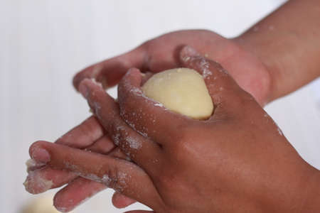 Close up image of bakery chef making bread dough in the kitchenの写真素材
