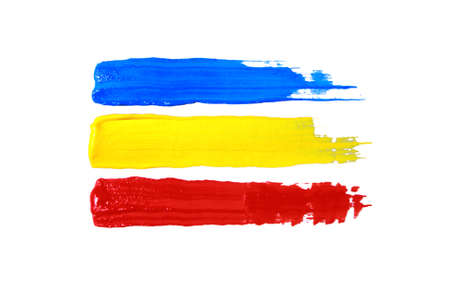 Colorful acrylic paints of primary colors red, yellow and blueの写真素材