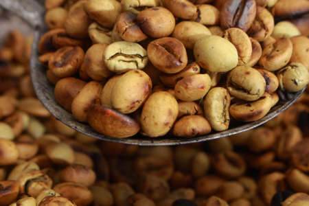 Traditionally roasting coffee beans in hot panの写真素材