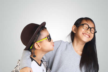 Portrait of young happy Asian brother and sisterの写真素材