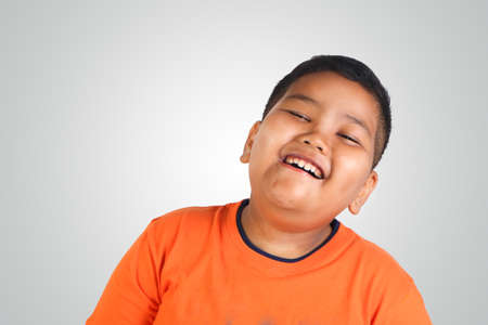 Half body portrait of happy and cute Asian boy smilingの写真素材