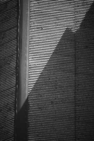 Abstract image of asian slums, dense village, house roof in black and white monochrome photoの写真素材