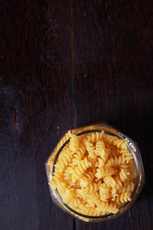 Photo image. Food photography. Italian Fusilli  Macaroni Pasta raw food background or texture close...