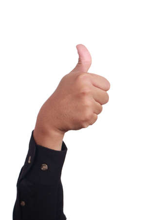 Close up image of hand gesturing thumb up sign isolated on whiteの写真素材