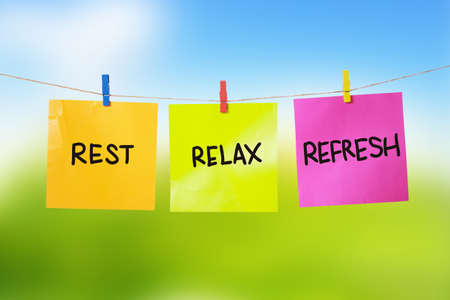 Rest, Relax, Refresh. Motivational inspirational quotes words. Colorful Paper with blurred...