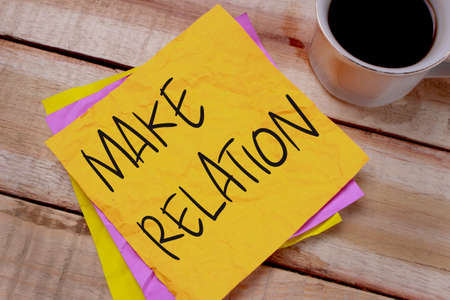 Make Relation. Motivational inspirational quotes words. Wooden background