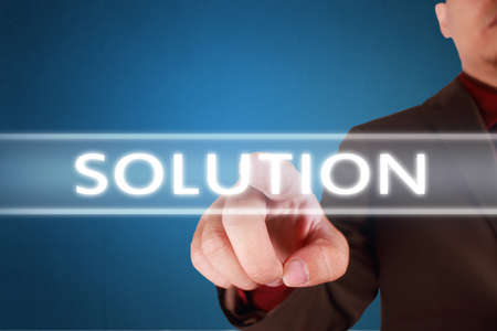 Business Concept. Businessman click solution word button on virtual screen. Modern Text typography...
