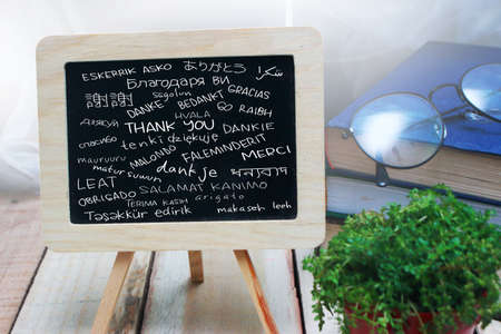 Thank you gratutide words letter in many languages, written on blackboard. Motivational business...