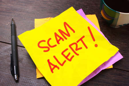 Scam Alert, Internet Fraudulent quotes, words typography top view lettering concept