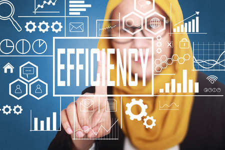 Business Concept. Businesswoman writing Efficiency words on virtual screen. Modern Text typography designの写真素材