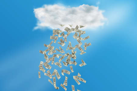 Composite image of cloud with rain of money with bright blue sky on the backgroundの写真素材
