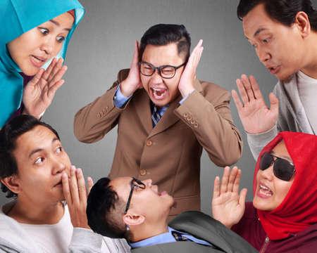Gossips or rumors spreads among people, man and woman tells secrets, whispering and listening, hoax conceptの写真素材